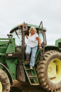 Kim Jo Bliss steps off tractor